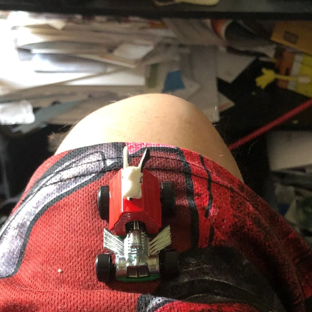 Red Toy Car with White Bull Figure